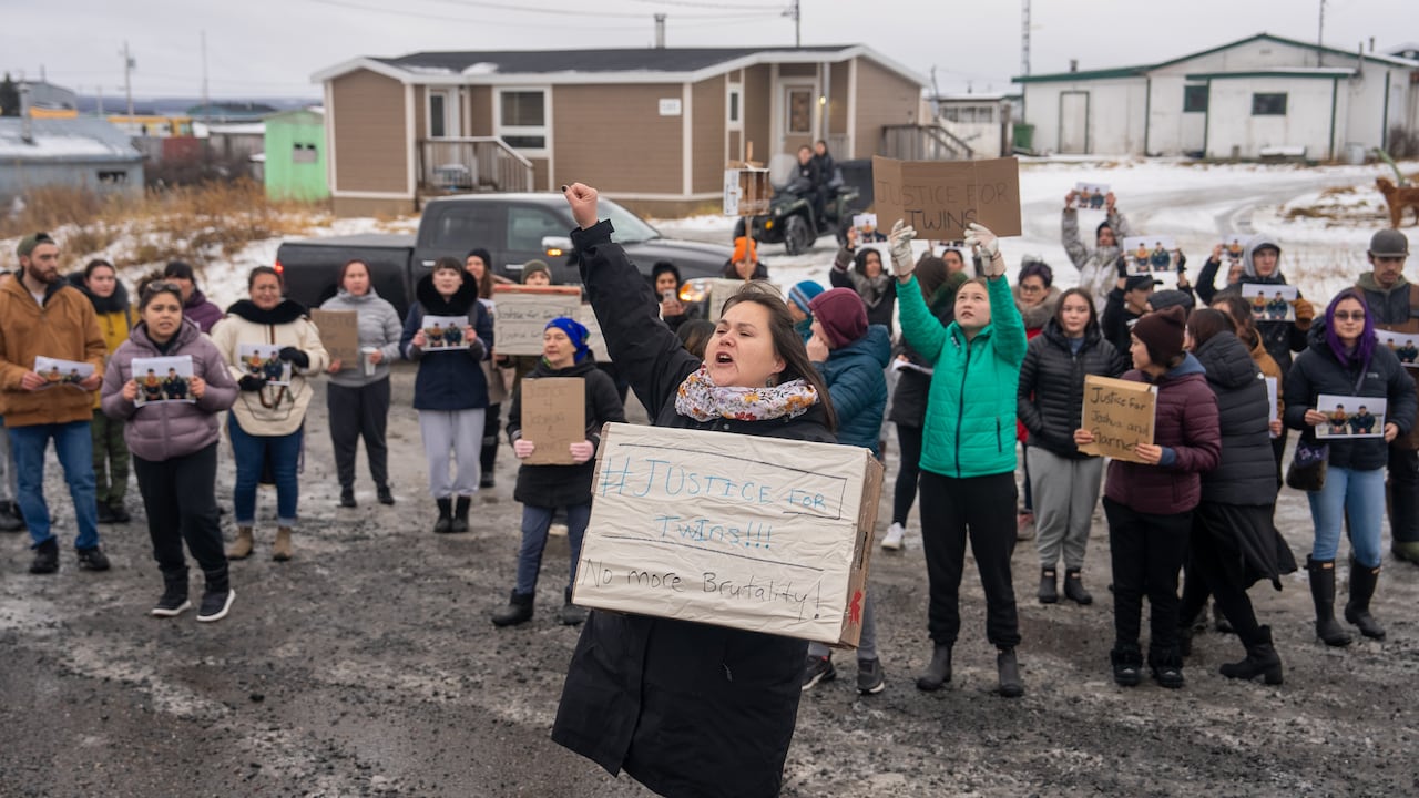 people standing with signs