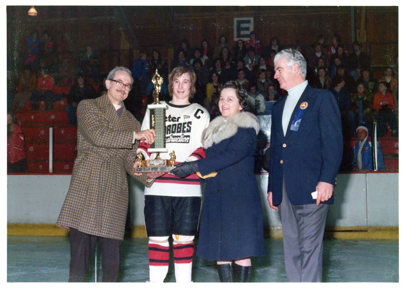 Hough's parents give out a trophy at a memorial hockey tournament named in Hough's honour.