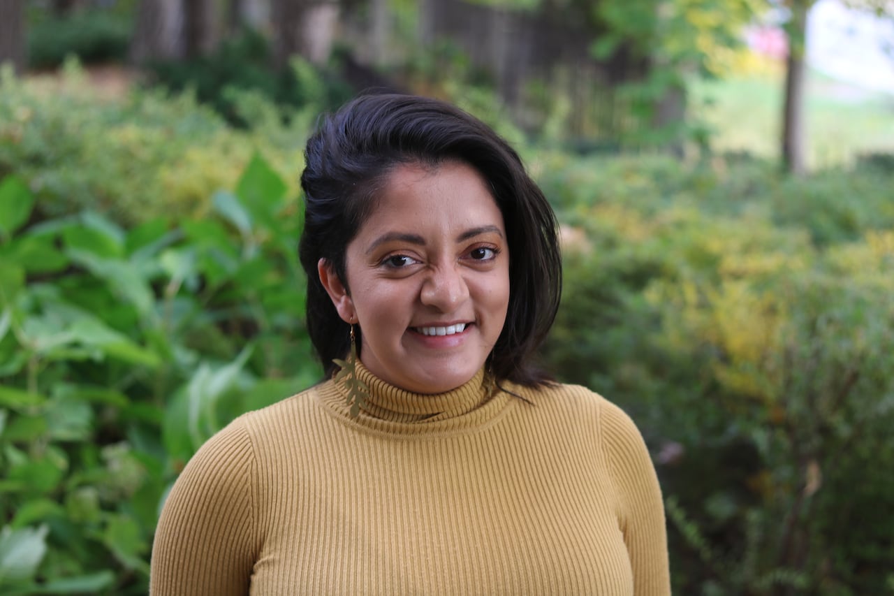 the representation of a pistillate who smiles into the camera