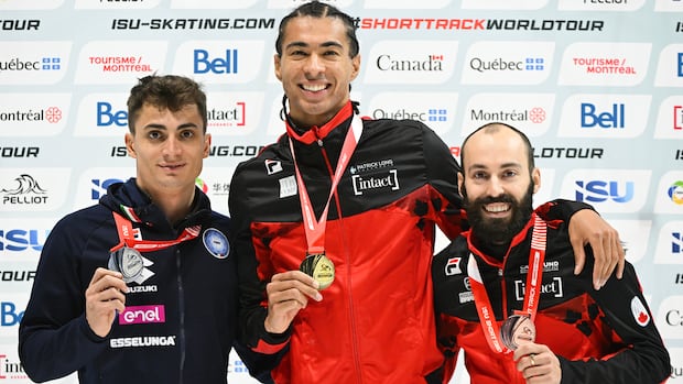 Italy's Pietro Sighel, and Canadians William Dandjinou and Steven Dubois celebrate their medals in Montreal on Oct. 11, 2025.