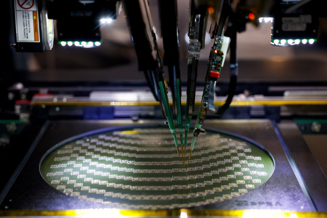 The semiconductor wafer is tested on the machine.