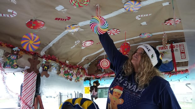 A woman in a decorated school bus