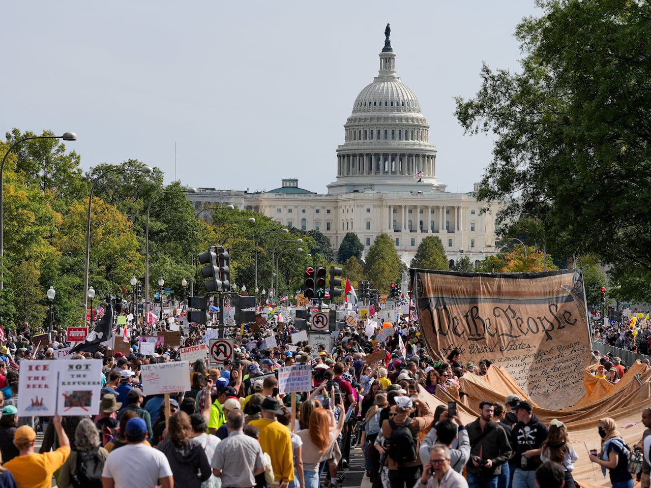 A crowd of protesters march near the U.S. Capitol building.