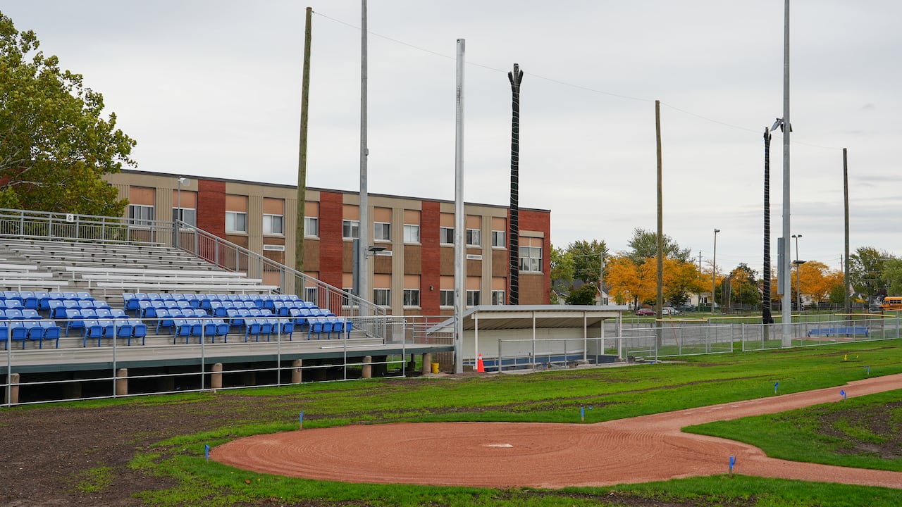 baseball field with rows of blue seats