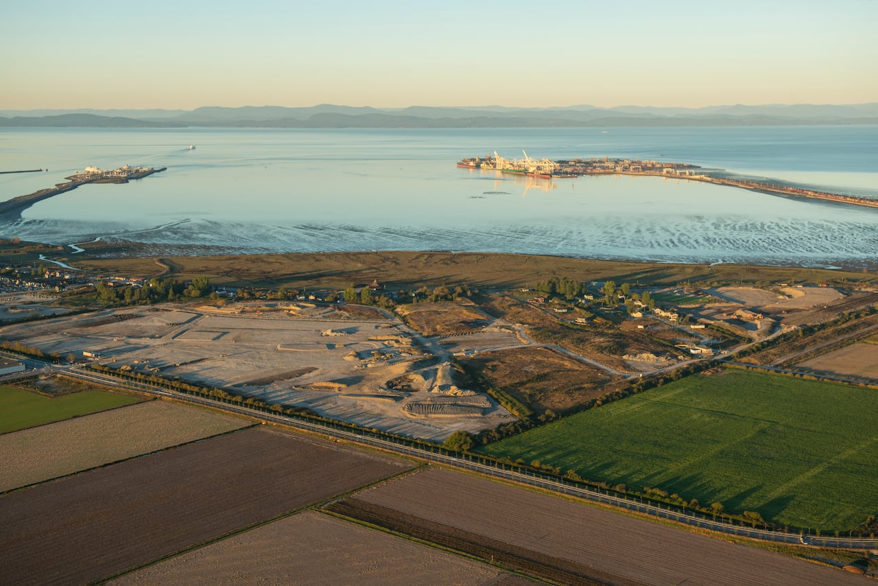 A aerial picture of land overlooking the ocean