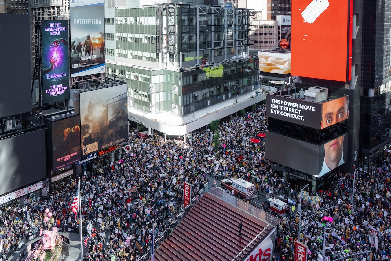A bird's-eye view of a massive crowd in New York City's Times Square.