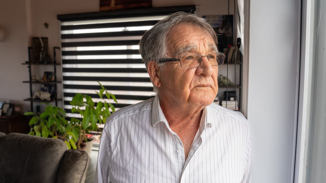 A man stares out a window 