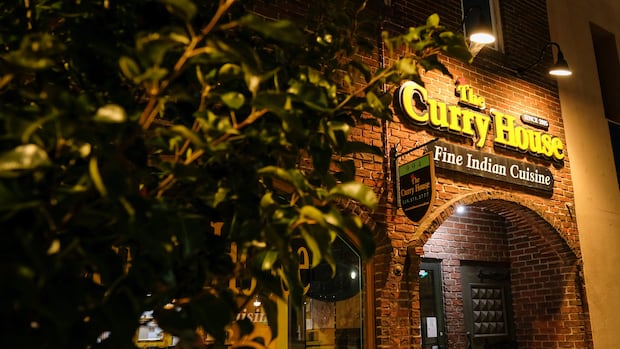 Sharif Rahman moved to Owen Sound, Ontario, in 2015, opening this popular downtown restaurant The exterior of a restaurant called The Curry House is shown at night.