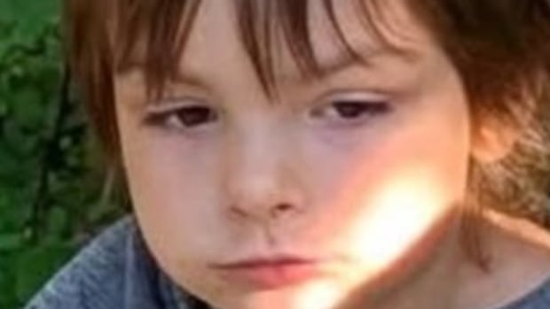 A young boy with brown hair. 
