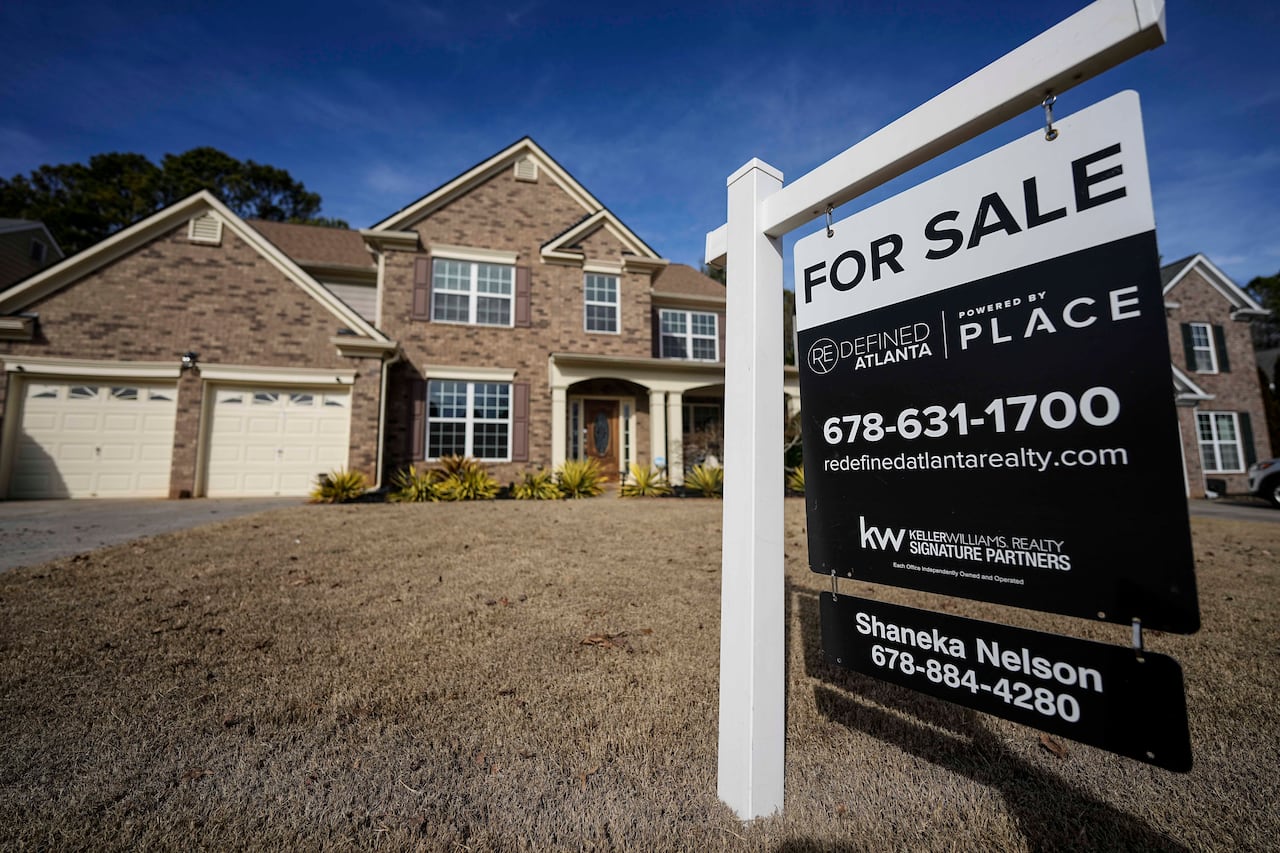 File - A sign announcing a home for sale is posted outside the home, February 1, 2024, in Aceworth, Ga., Edude Atlanta. One of the reasons for the sharp run-up in home loan costs is that few mortgages in previous years have had a much wider gap than this one