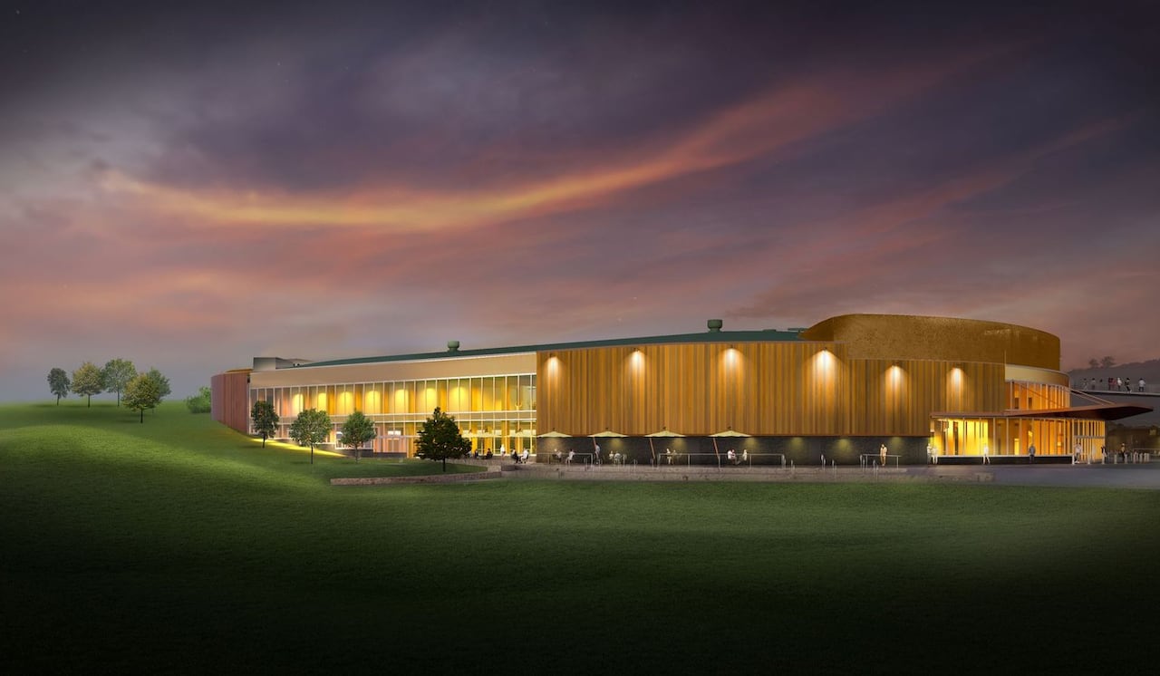 A rendering of an arena next to a field
