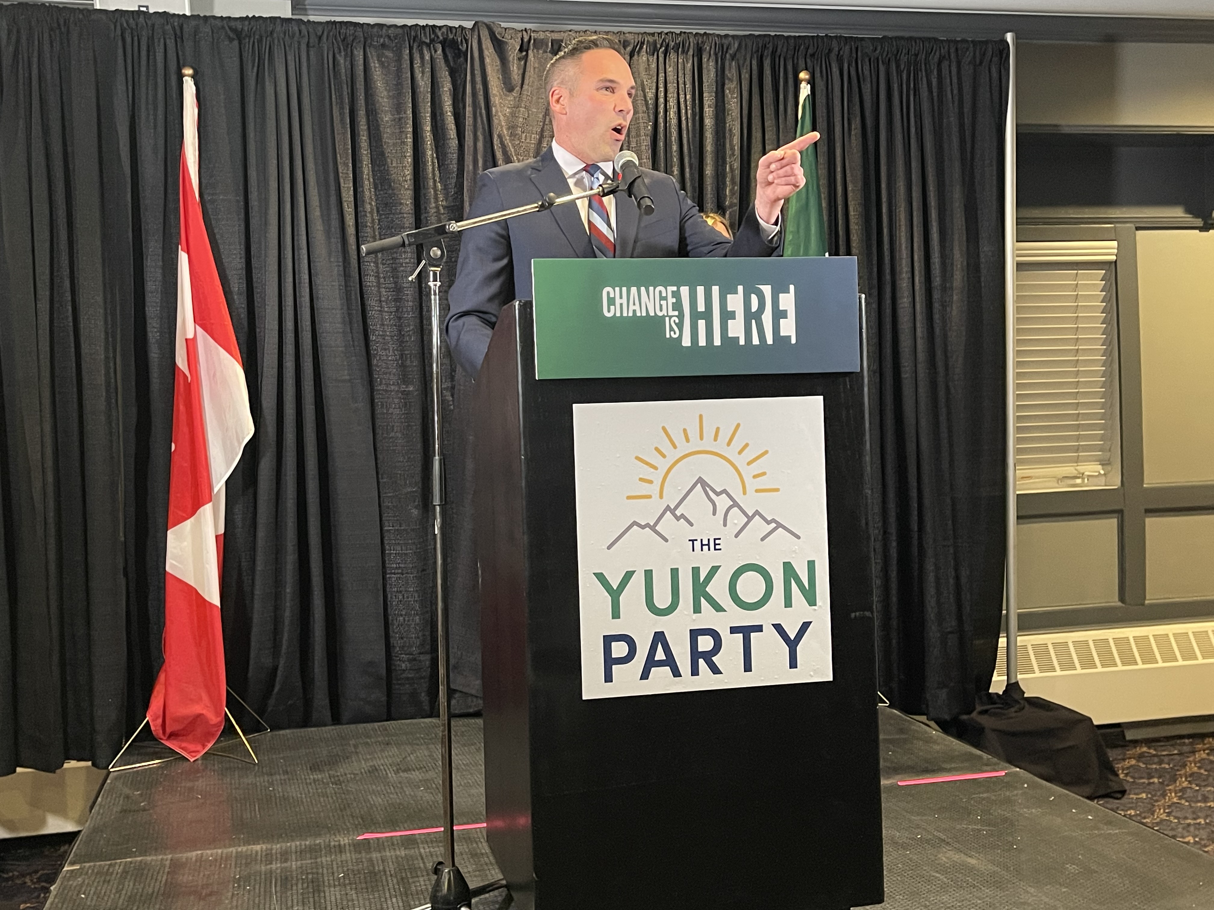 Yukon Party Leader Currie Dixon on election night, Nov. 3, 2025. A man speaks from behind a podium.