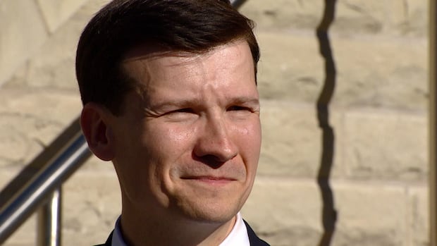 A man smiles