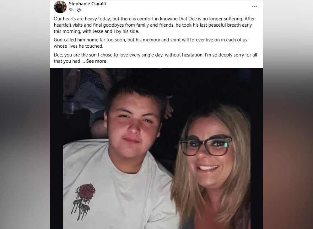 A young man is at left, beside a woman with long blonde hair and glasses