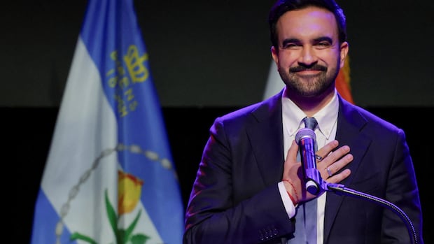 A man touches his chest in gratitude