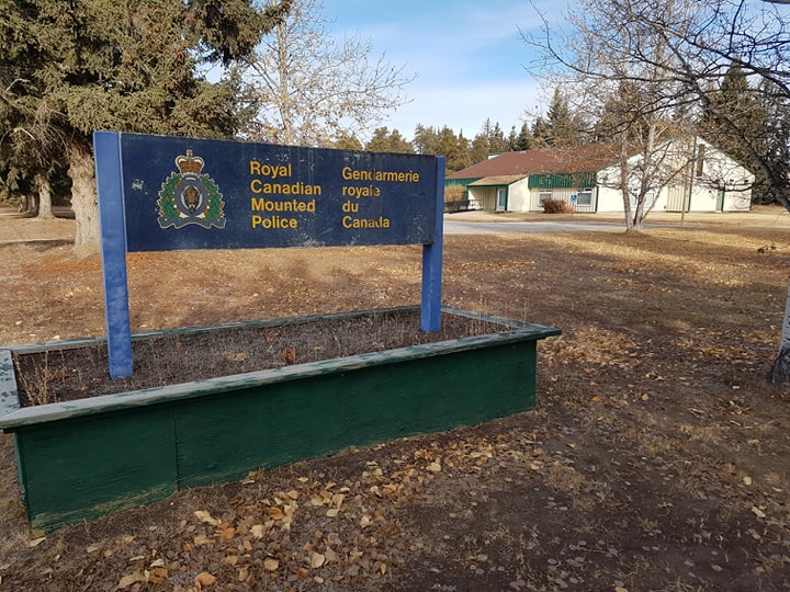 The RCMP detachment in Fort Smith. A car crash over the weekend has led to a search for a potentially-injured teenage boy. a sign of rcmp in a grassy area