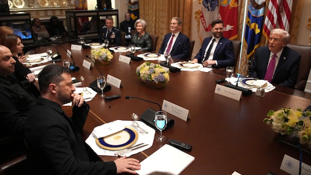 Donald Trump, J.D. Vance, Volodymyr Zelenskyy, and other leaders and politicians sit at a conference table.