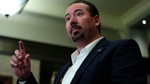 Ontario Regional Chief Abram Benedict speaks at a news conference against Bill C-5 in the Foyer of the House of Commons on Parliament Hill in Ottawa, on Tuesday, June 17, 2025.  A man in a suit makes a gesture.