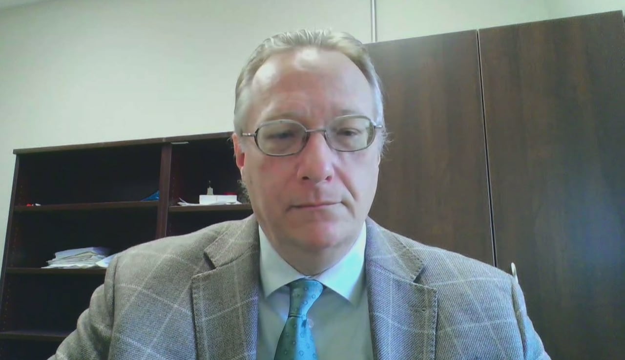 A man wearing a suit and tie.