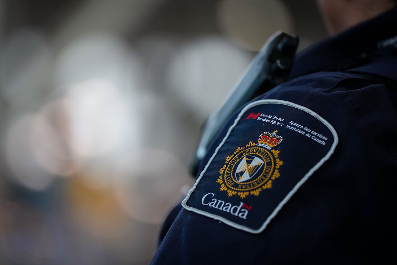 A Canada Border Services Agency patch is seen on the uniform of a CBSA officer.