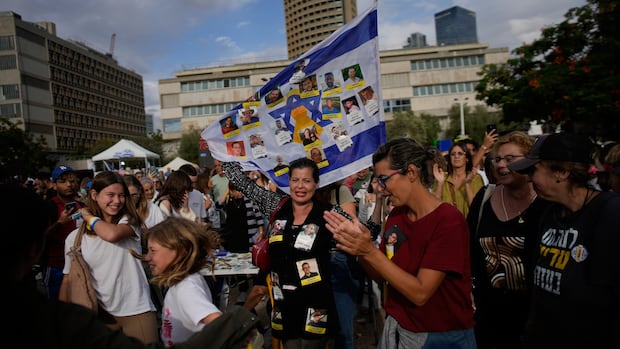 People react as they celebrate following the announcement that Israel and Hamas have agreed to the first phase of a peace plan to pause the fighting.