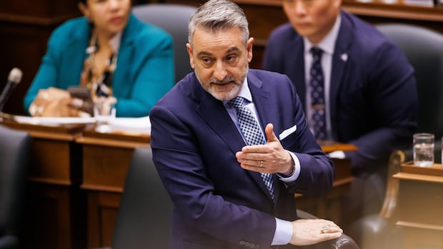 PC MPP Paul Calandra speaks during Question Period at Queen's Park in Toronto on Tuesday, May 13, 2025. THE CANADIAN PRESS/Cole Burston A man in a blue suit stands in front of other seated people