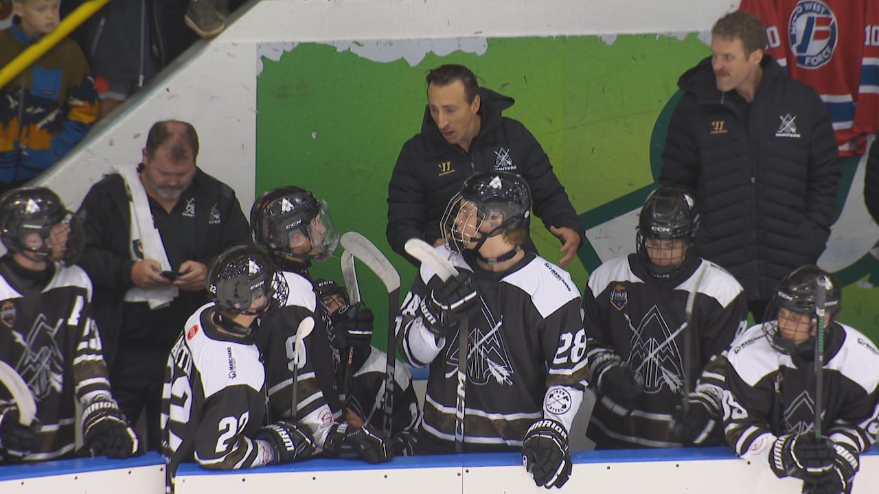 a hockey team on the bench