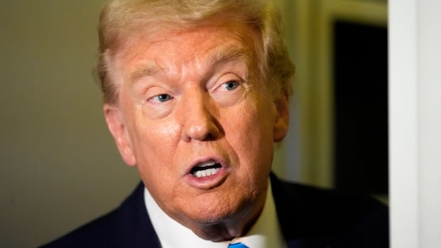 President Donald Trump speaks with reporters aboard Air Force One at Al Udeid Air Base in Doha, Qatar, Saturday, Oct. 25, 2025. Donald Trump on a plane