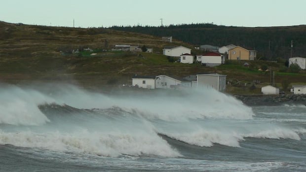 Waves pounded the shores of Trepassey, near the southeastern corner of Newfoundland's Avalon Peninsula, on Sunday morning. view of shoreline with large waves.