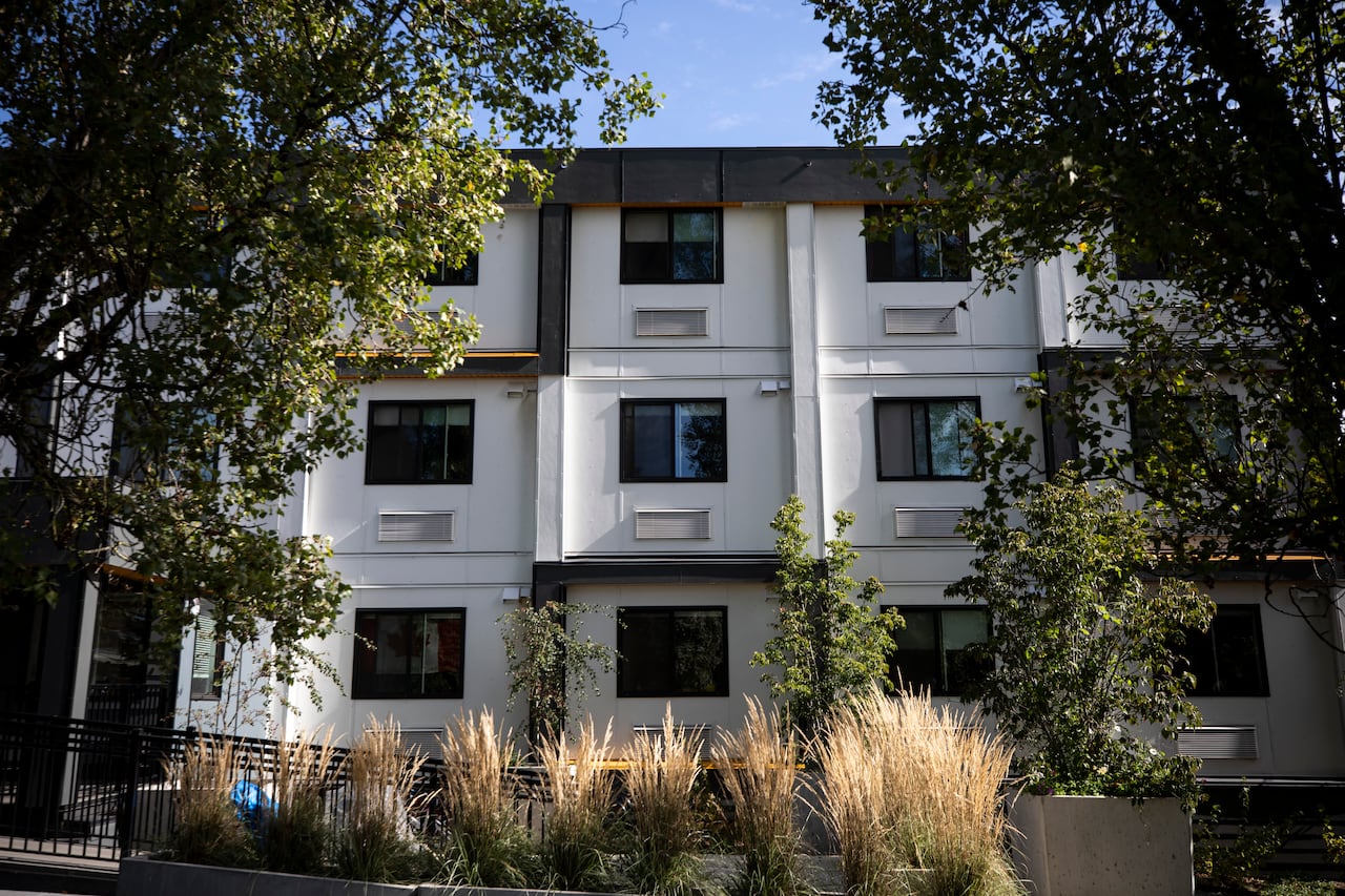 Repeated, a three -storey apartment complex of window classes is made of leafy trees.